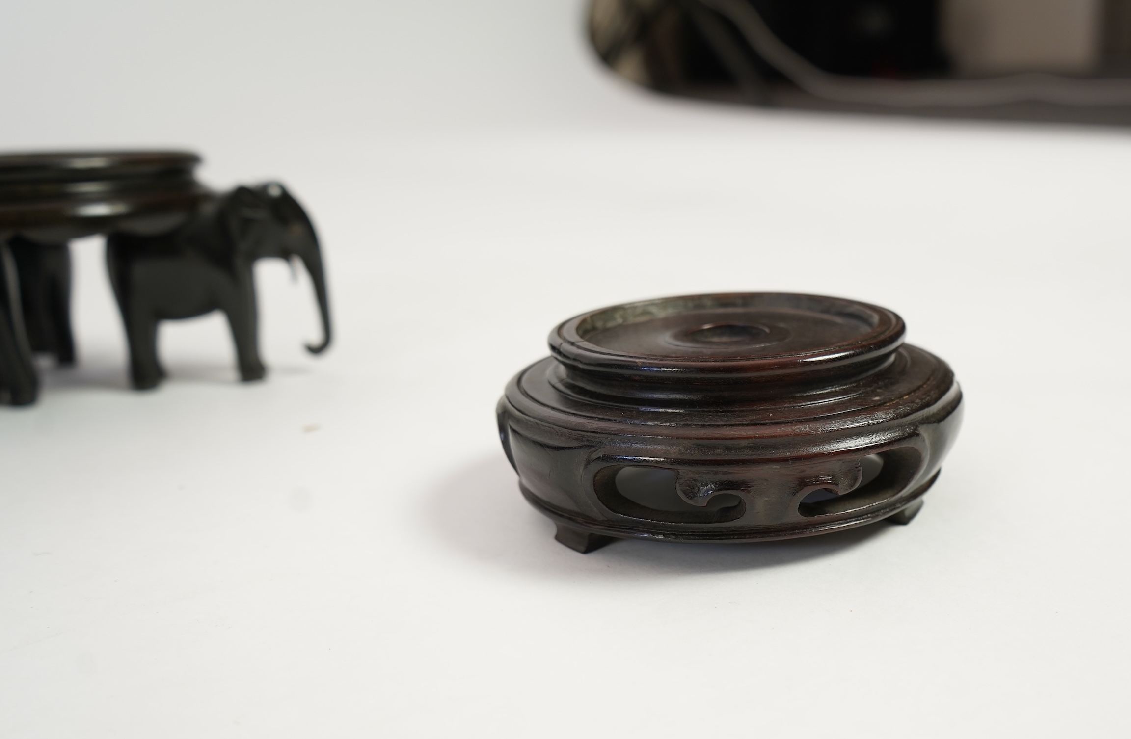 A group of sixteen Chinese hardwood stands together with a Japanese stand, 19th/20th century